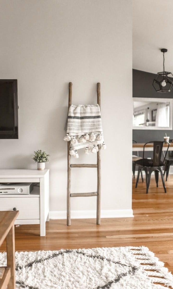 Elegant modern living room with minimal decor and wooden accents.