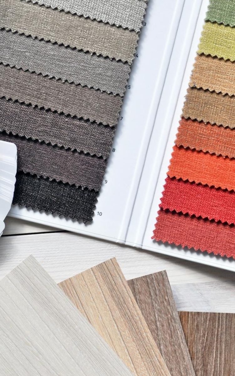 Colorful fabric and paint swatches laid out for design inspiration and material selection.