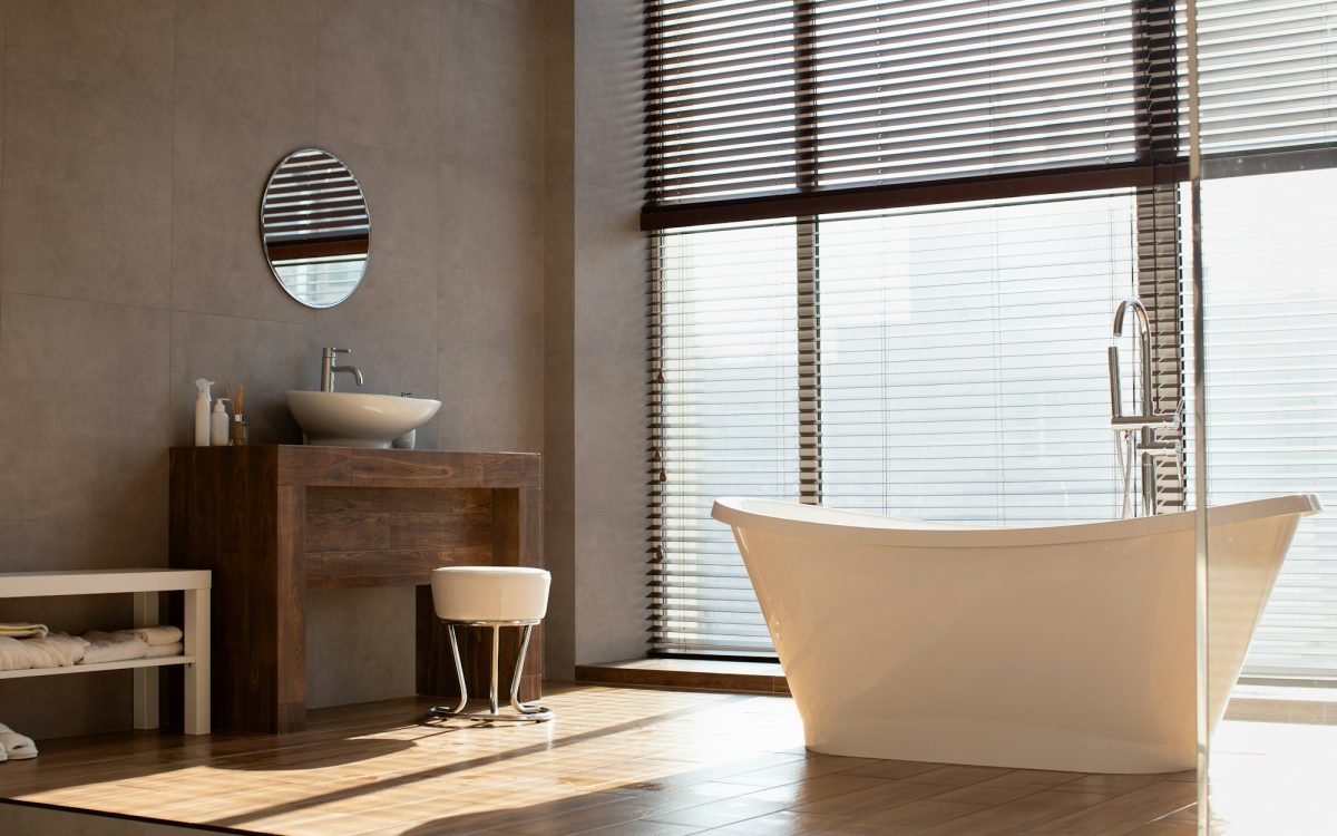 Modern bathroom with panoramic window in luxury apartment