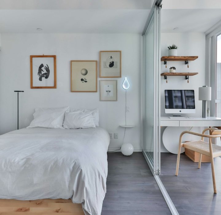 Photo by Lotus Design N Print a bedroom with a bed, desk, and a window